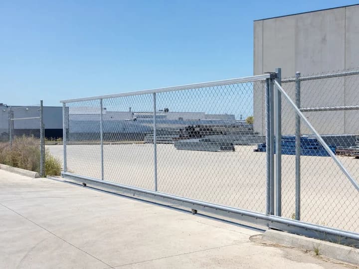 Galvanised chain wire sliding gate across a Melbourne factory driveway